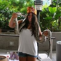 Shirley Casper of Cremorne, NSW entered this photo of Annie Casper with a python in Singapore in January 2011.