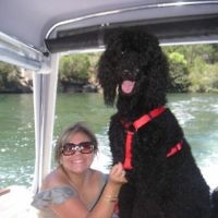 Ruth Faludi of Bondi Junction, NSW, is pictured with her pet dog Chico on the Hawkesbury River in May 2010.