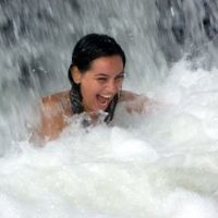 Rebecca Shonberg of McKinnon, Victoria, cools off at the bottom of YS Falls in Jamaica in September 2010.