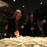 Yom Hazikaron 2011. Robert Blackwood Hall, Monash University. Members of the public lighting memorial candles. Photo: Peter Haskin