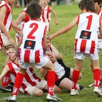 28-8-11. AJAX Under 12 Jets premiers 2011, defeating Mordialloc Braeside. Ryan Marks holds off 6 opposition players. Photo: Peter Haskin 28-8-11. AJAX Under 12 Jets premiers 2011, defeating Mordialloc Braeside. Ryan Marks holds off 6 opposition players. Photo: Peter Haskin