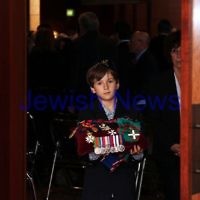 13-12-11. Memeorial service for former Australian Governer General, Sir Zelman Cowen. Held at Temple Beth Israel, Alma Rd., East St Kilda. Mitch Cowen, Grandson of Sir Zelman leads the coffin out carrying his grand father's medals. Photo copyright: AJN/Peter Haskin.