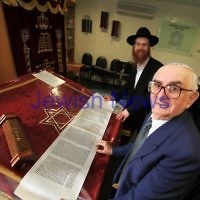 Josef Rewinson with the Megillat Rut he donated to the Emmy Monash shul. Seen here with the Megillat and Rabbi Michal Stern. photo: peter haskin