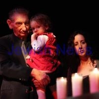 Yom Hashoa 2011. Survivor Peter Steiner holding his grand daughter Emma Steiner. Natalie Ovadia (centre) and Sue Gorn look on.  Holocaust rememberance ceremony, Robert Blackwood Hall, Monash University. Photo: Peter Haskin
