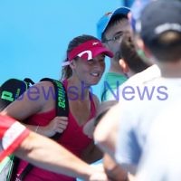 17-1-12. Australian Open 2012. Womens Round 1. Shahar Peer v Isabella Holland. Peer posing for a photograph with a fan. Photo: Peter Haskin 17-1-12. Australian Open 2012. Womens Round 1. Shahar Peer v Isabella Holland. Peer posing for a photograph with a fan. Photo: Peter Haskin