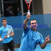 Maccabi Tennis pennent . 26-5-12. Asaf Nagar plays a winner at the net with partner Paul Arber looking on.  Photo: Peter Haskin