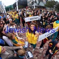 22-8-12. A packed Federation Square in Melbourne welcomes home Australia's medalists from the London 2012 Olympics. Jewish silver medalist in the Kayak, Jessica Fox holds her medal up for the camera. Photo: Peter Haskin