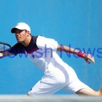 Australian Open 2013. Round 1, Mens Doubles.  Jonathan Erlich (ISR) / Kevin Anderson (RSA) def 2nd seeds Leander Paes (IND) / Radek Spepanik (CZE)  6-3 7-5.  Photo: Peter Haskin