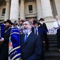29-1-12. East Melbourne Hebrew Congregation. Double Torah dedication at Queens Hall, Parliament House, Victoria. Chief Rabbi Lord Jonathan Sacks carries one of the Torah's down the steps of parliament House in a procession to the East Melbourne shul.  Photo: Peter Haskin.
