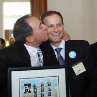 A very happy Israeli ambassador Yuval Rotem plants a kiss on ZFA president Philip Chester at the conclusion of cocktail reception at Parliament House for Israel's 60th. photo: peter haskin