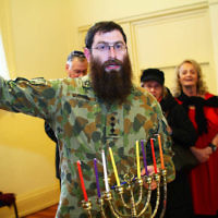 5-12-13. Last day of Chanukah. East Melbourne Hebrew Congregation. Rabbi David Gutnick, Jewish Chaplain with the Australian Defense Force, organised a candle lighting ceremony incorporating members of the ADF and guests that included Felix and Yvonne Sher, parents of Private Greg Sher who was killed in Afganistran.  Photo: Peter Haskin