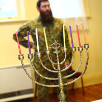 5-12-13. Last day of Chanukah. East Melbourne Hebrew Congregation. Rabbi David Gutnick, Jewish Chaplain with the Australian Defense Force, organised a candle lighting ceremony incorporating members of the ADF and guests that included Felix and Yvonne Sher, parents of Private Greg Sher who was killed in Afganistran.  Photo: Peter Haskin