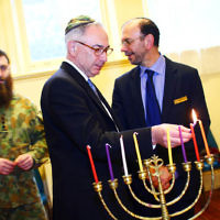 5-12-13. Last day of Chanukah. East Melbourne Hebrew Congregation. Rabbi David Gutnick, Jewish Chaplain with the Australian Defense Force, organised a candle lighting ceremony incorporating members of the ADF and guests that included Felix and Yvonne Sher, parents of Private Greg Sher who was killed in Afganistran.  Photo: Peter Haskin