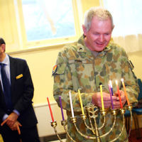 5-12-13. Last day of Chanukah. East Melbourne Hebrew Congregation. Rabbi David Gutnick, Jewish Chaplain with the Australian Defense Force, organised a candle lighting ceremony incorporating members of the ADF and guests that included Felix and Yvonne Sher, parents of Private Greg Sher who was killed in Afganistran.  Photo: Peter Haskin
