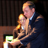 18-4-10. Yom Hazikaron. Robert Blackwood Hall, Monash University. Israeli Ambassador Yuval Rotem lights a memorial candle. photo: peter haskin
