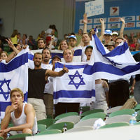Australian Open 2008. Mens doubles final, winners Andy Ram and Jonathan Erlich. Israeli ambassador Yuval Rotem (centre) with the crowd holding Israeli flag.  photo:peter haskin