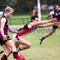 26-4-14. AJAX lost to Old Haileybuty by 27 points at Princes Park, Caulfield. Warren Steinberg attempts to smother. Photo: Peter Haskin 26-4-14. AJAX lost to Old Haileybuty by 27 points at Princes Park, Caulfield. Warren Steinberg attempts to smother. Photo: Peter Haskin