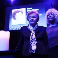 27-4-14. Yom ha Shoah memorial at Robert Blackwood hall, Monash University. Survivor of Auschwitz, Katalin Loffler with her daughter Margalit Casey, light one of the six memorial candles. Photo: Peter Haskin