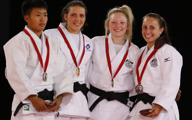 Amy Meyer (right) pictured with fellow judo medal-winners in the women’s under-48kg category in Glasgow, Scotland.
Photo: AP Photo/Frank Augstein