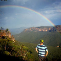 Dovi Broner admires the view, including a spectacular  rainbow, in the Blue Mountains, NSW.