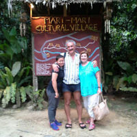 Philip and Julie Swedosh meet a local resident at the Mari-Mari Cultural Village in Kota Kinabalu, Borneo in July 2014.