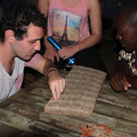 Steven Curtis  entered this photo of Max playing a game of nsolo with a local in Zambia in July 2014.