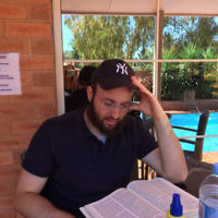 Rabbi Daniel Rabin studies Torah at an Albury motel.