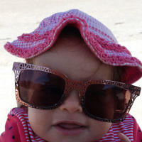 Nine-month-old Gitty Abenaim chilling out at Aspendale Beach, Victoria.