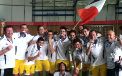 The Australian futsal team celebrates gold at the 2011 EMG.