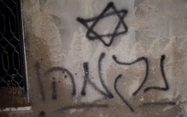 Graffiti at the site of the attack, which says "revenge"