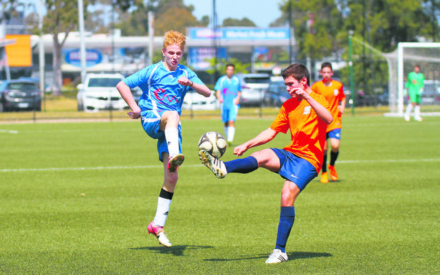 Maccabi under-16 soccer player Jacob Rohald (left) from NSW and Jayden Casselson from Victoria competing in the Maccabi 90th Interstate Challenge at the Kingston Heath Soccer Complex on Sunday.	Photo: Peter Haskin
