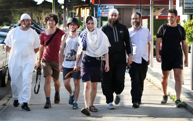 Yitzi Tuvel (centre) walking from
Bondi to Lakemba
Mosque accompanied
by (from left) Mazen
Zraika, Yehuda
Aharon, Nathan
Simmon, Ayman Abu
Farha, Rabbi
Zalman Kastel and Yanky Klein.
Photo: Noel Kessel