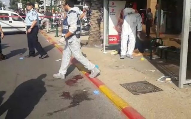 Police investigators at the scene of a stabbing attack in Ra’anana.
