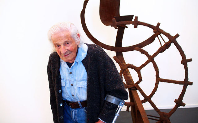 Artist Erwin Fabian with one of his steel sculptures. Photo: Peter Haskin