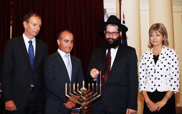 Chanukah at Victorian Parliament House. From left: David Southwick,  James Merlino, Rabbi Chaim Herzog,  Myriam Boisbouvier-Wylie, honorary Consul general of France in Melbourne. Photo: Peter Haskin