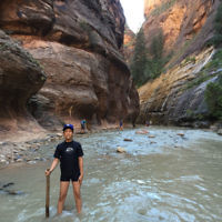 Harry Baral walking "The Narrows" in Zion National Park in Utah, USA.