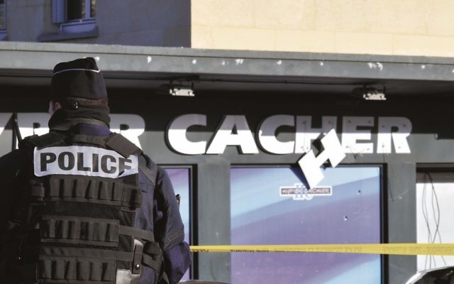 Police stand guard outside Hyper Cacher  last January. Photo:  Serge Attal/Flash90