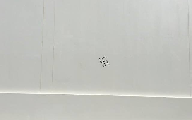The swastika graffiti on the wall of Maroubra Synagogue.