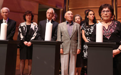 Lighting of the memorial candles at a past Yom Hashoah commemoration in Sydney. Photo: Giselle Haber