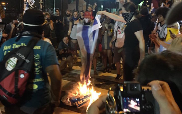 Protesters burning an Israeli flag outside the Democratic convention in Philadelphia, July 26, 2016.
