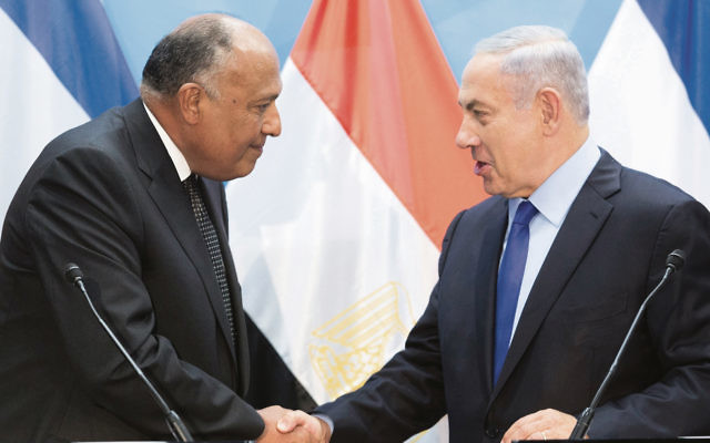 Egyptian Foreign Minister Sameh Shoukry (left) shakes hands with Israeli Prime Minister Benjamin Netanyahu during a joint brief statement to the media at the Prime Minister’s office in Jerusalem this week.
Photo: EPA/Abir Sultan.