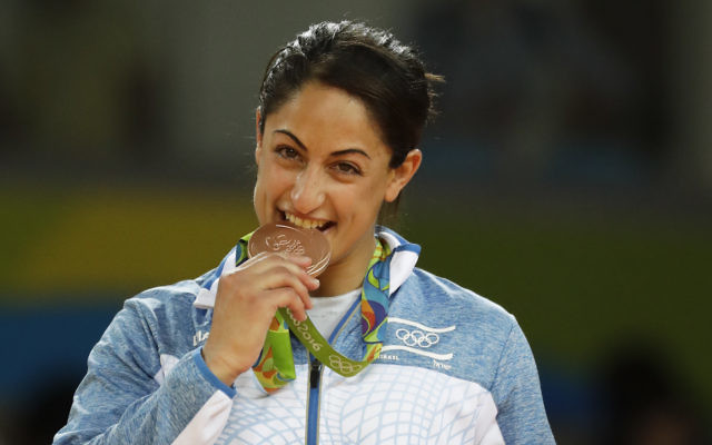 Israel's Yarden Gerbi stands on the podium after winning the bronze medal in the women's 63 kg judo competition of the 2016 Summer Olympics in Rio de Janeiro. i(AP Photo/Gregory Bull)