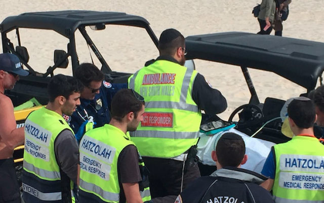 Hatzolah volunteers assist with the rescue of two Indonesian Muslim teenagers at Bondi Beach on August 30.