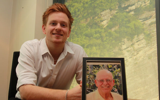 Remember September fundraising campaign founder Ben Wilheim with a photo of his father, Danny, who died in 2014 from pancreatic cancer.
Photo: Shane Desiatnik.