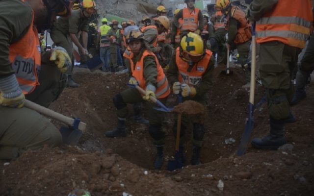 Rescue personnel digging in the search for missing workers at a construction site collapse in Tel Aviv, Sept. 5, 2016. (JTA)