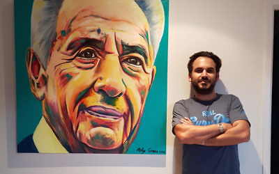 Moty Grau with the painting of Shimon Peres.