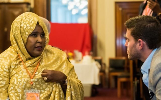 Alon Cassuto speaks with a member of Melbourne's Somali community. Photo: James McPherson Photography