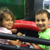 Rachel Teller entered this photo of her children Raph and Mia enjoying the penguin ride at the Sydney Aquarium.