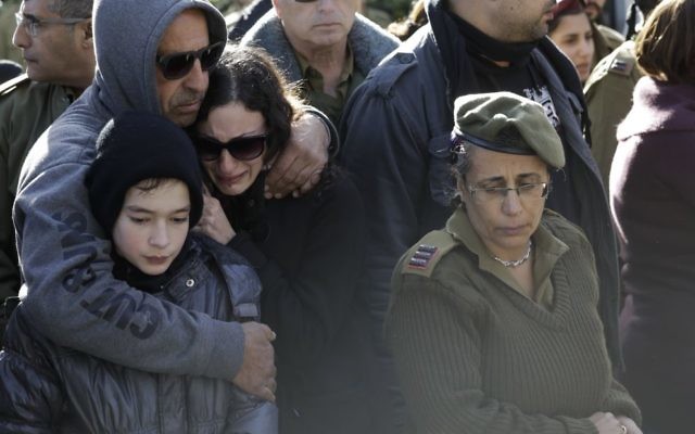 Mourners at the funeral of Israeli soldier Shir Hajaj, 22. Photo: AP Photo/Tsafrir Abayov.