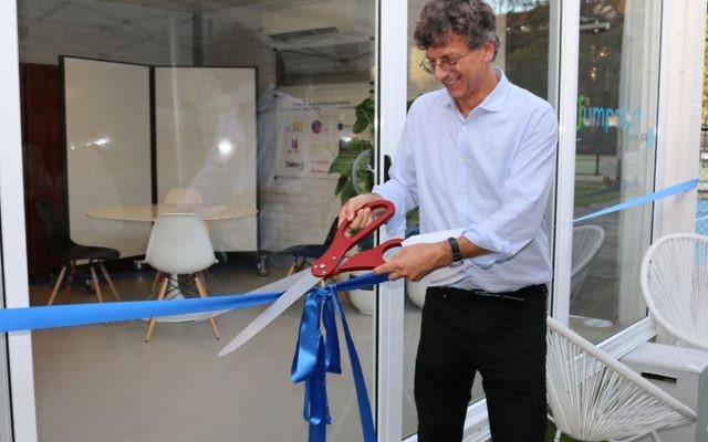 Chair of The Giving Forum Steering Committee Greg Shand cuts the ribbon to open the new Innovation Hub. Photo: Elyse Chiert.